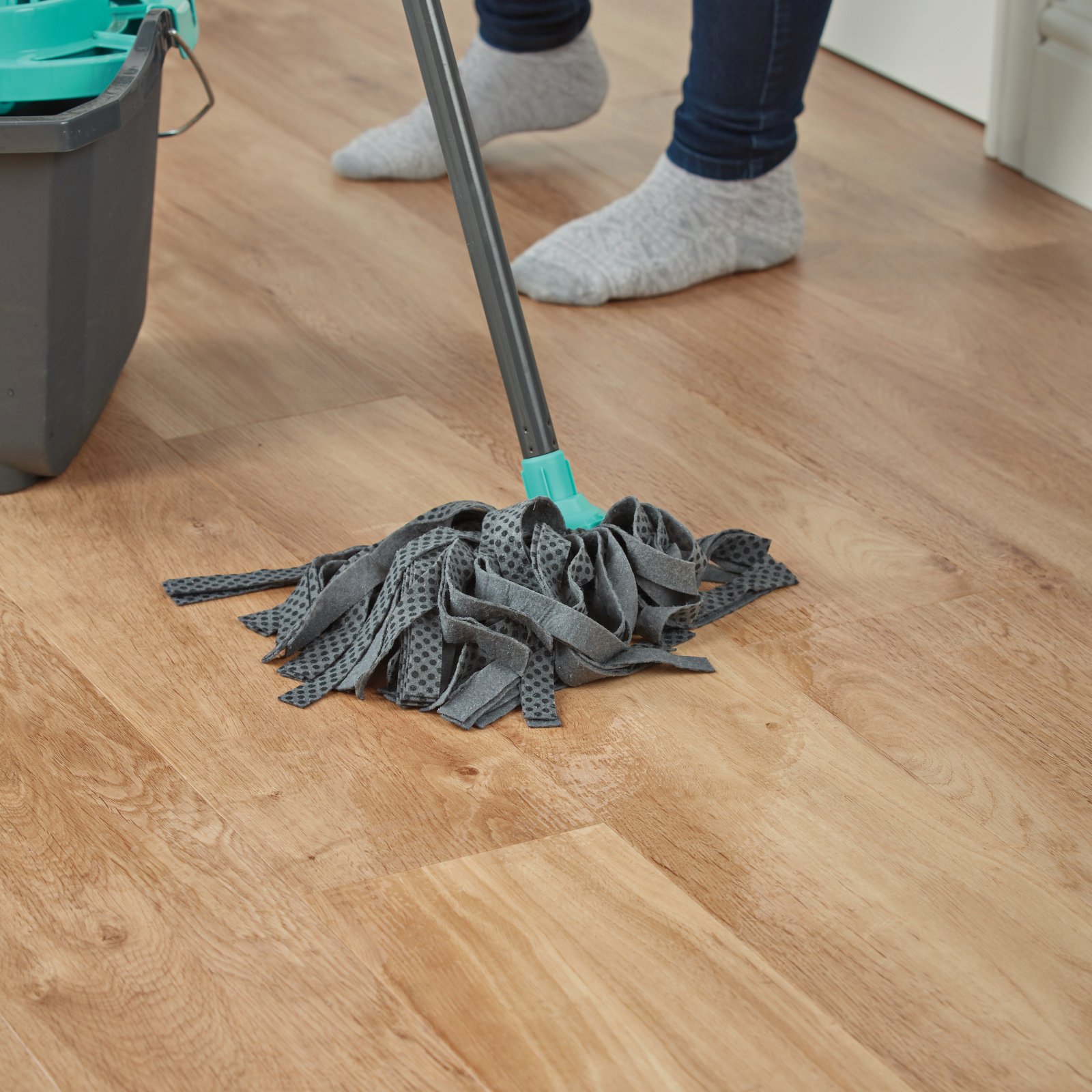 Person mopping French Oak VGW85T | SCB85 floors