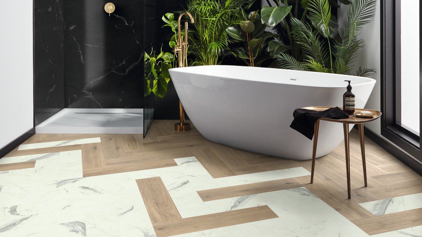 Karndean mix of wood and marble flooring in herringbone laying pattern in a bathroom