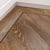 Border made with DS06 10mm design strips surrounded by DS02 3mm design strips in the Hessian Oak VGW93T floors