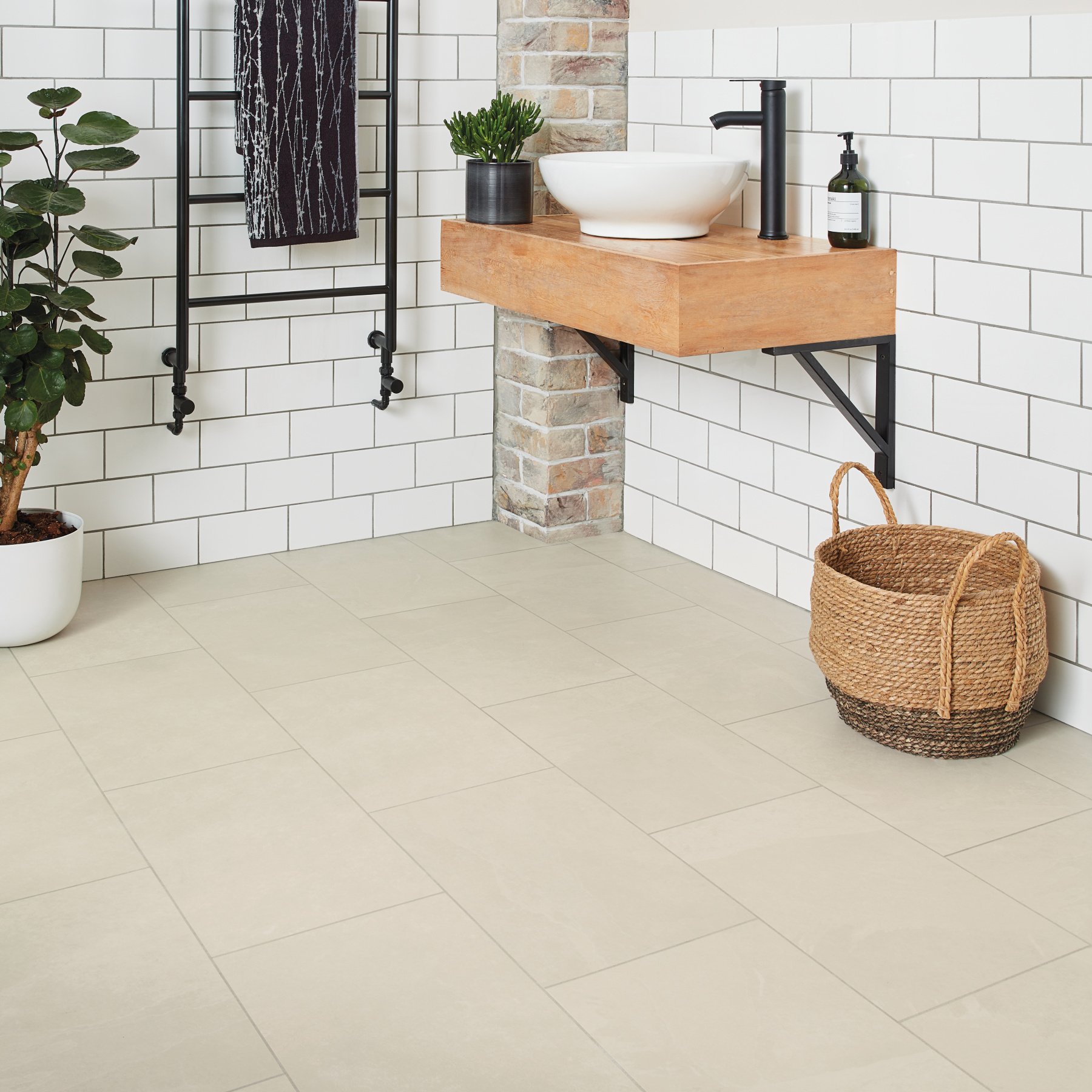 Karndean Ivory riven slate stone flooring with design strips in a bathroom