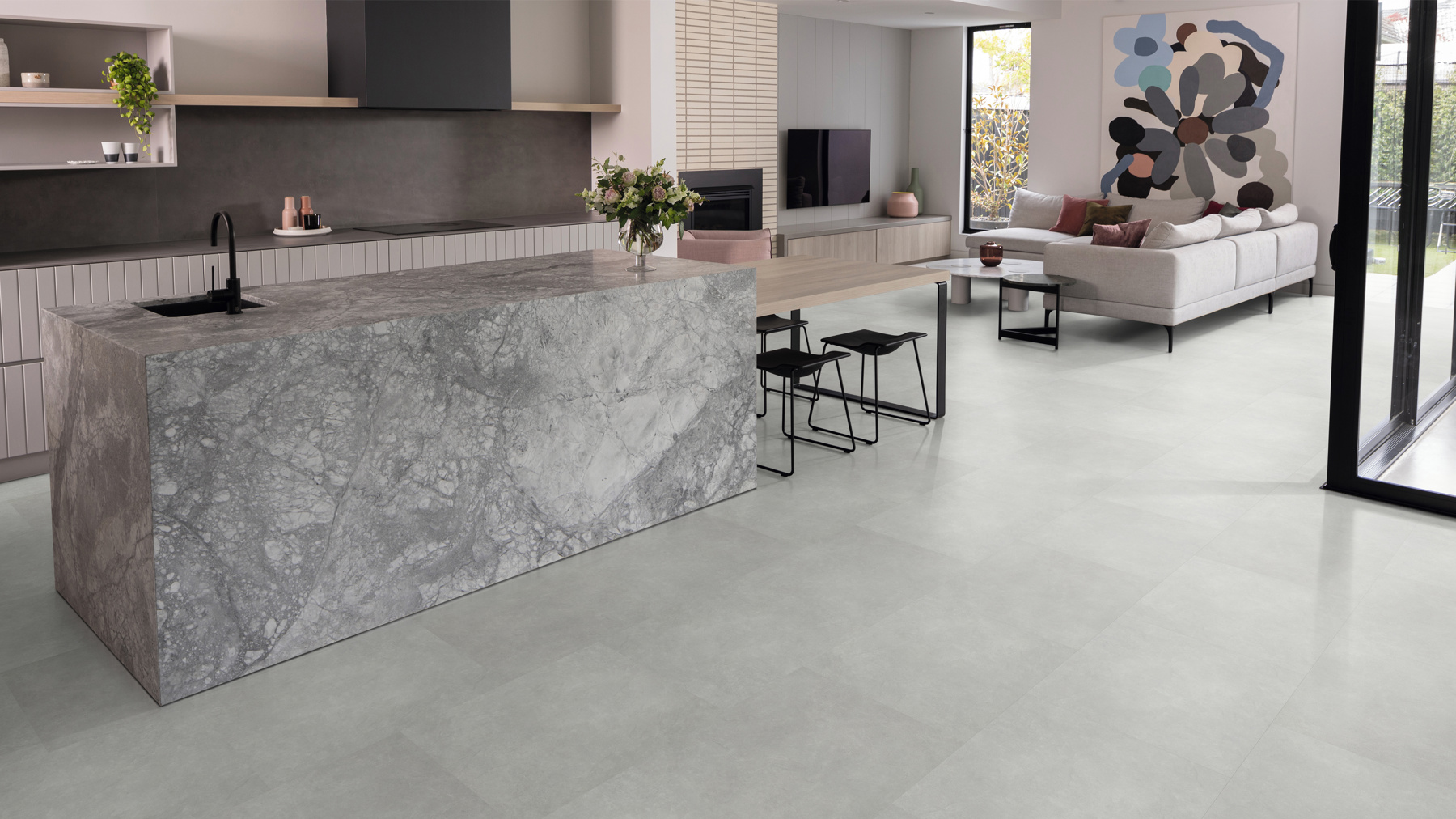 Open kitchen with stone style luxury vinyl flooring