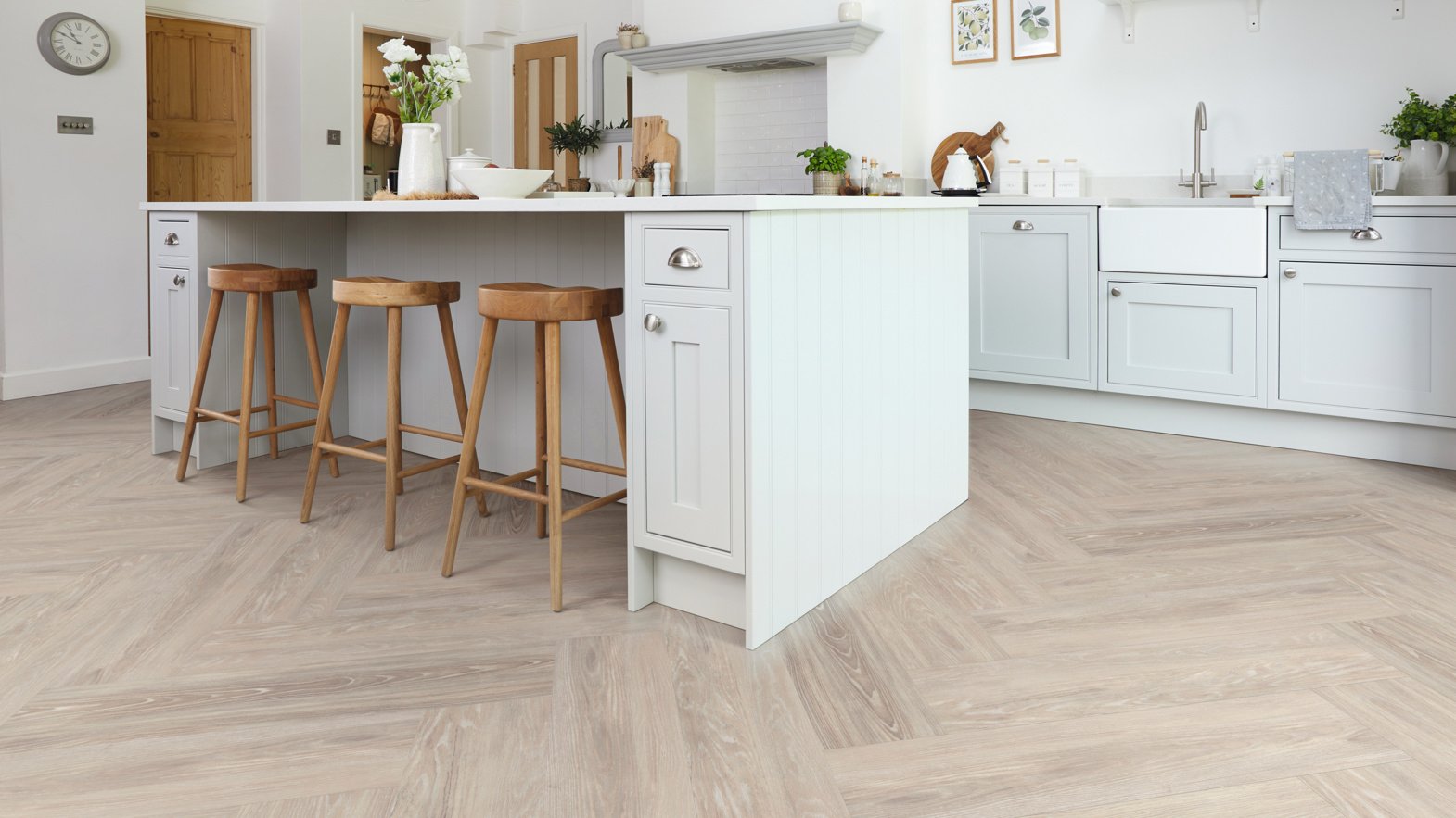 Ashland LLP95 lvt floors in a herringbone pattern in a white kitchen